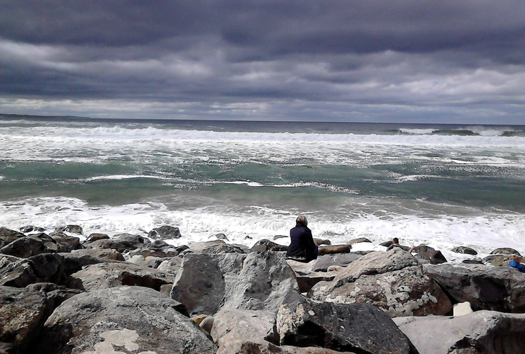 Sitting at waters edge