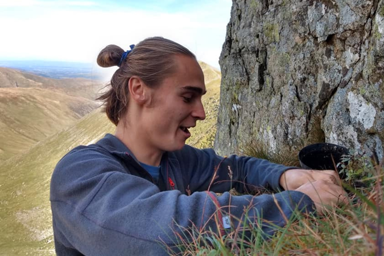 Isaac planting on crags