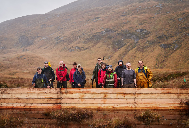 The leaky wooden dam will help to raise the water level