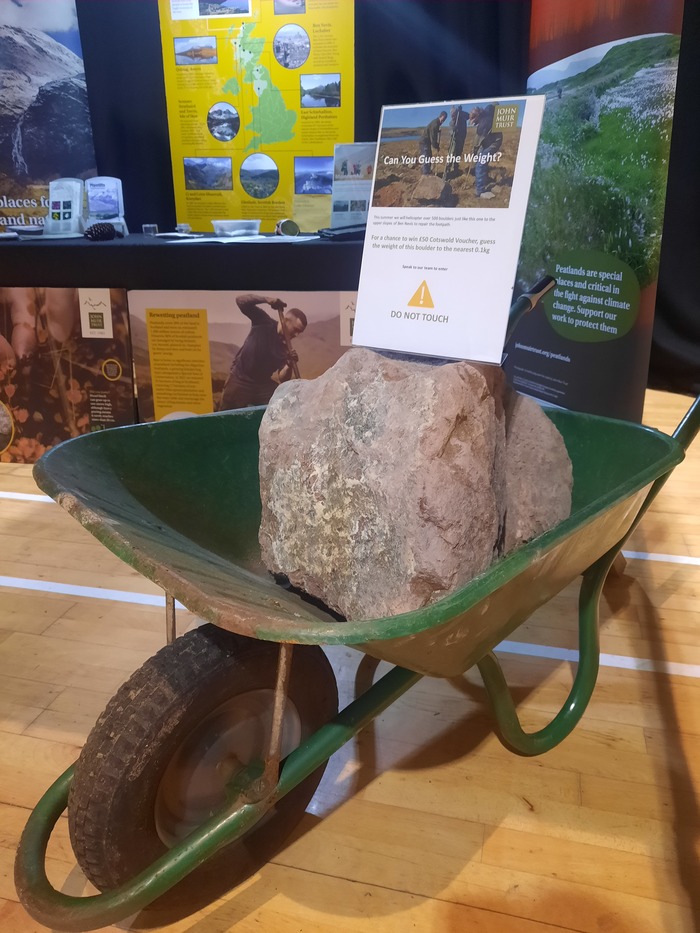 A block of path building stone in a wheelbarrow 